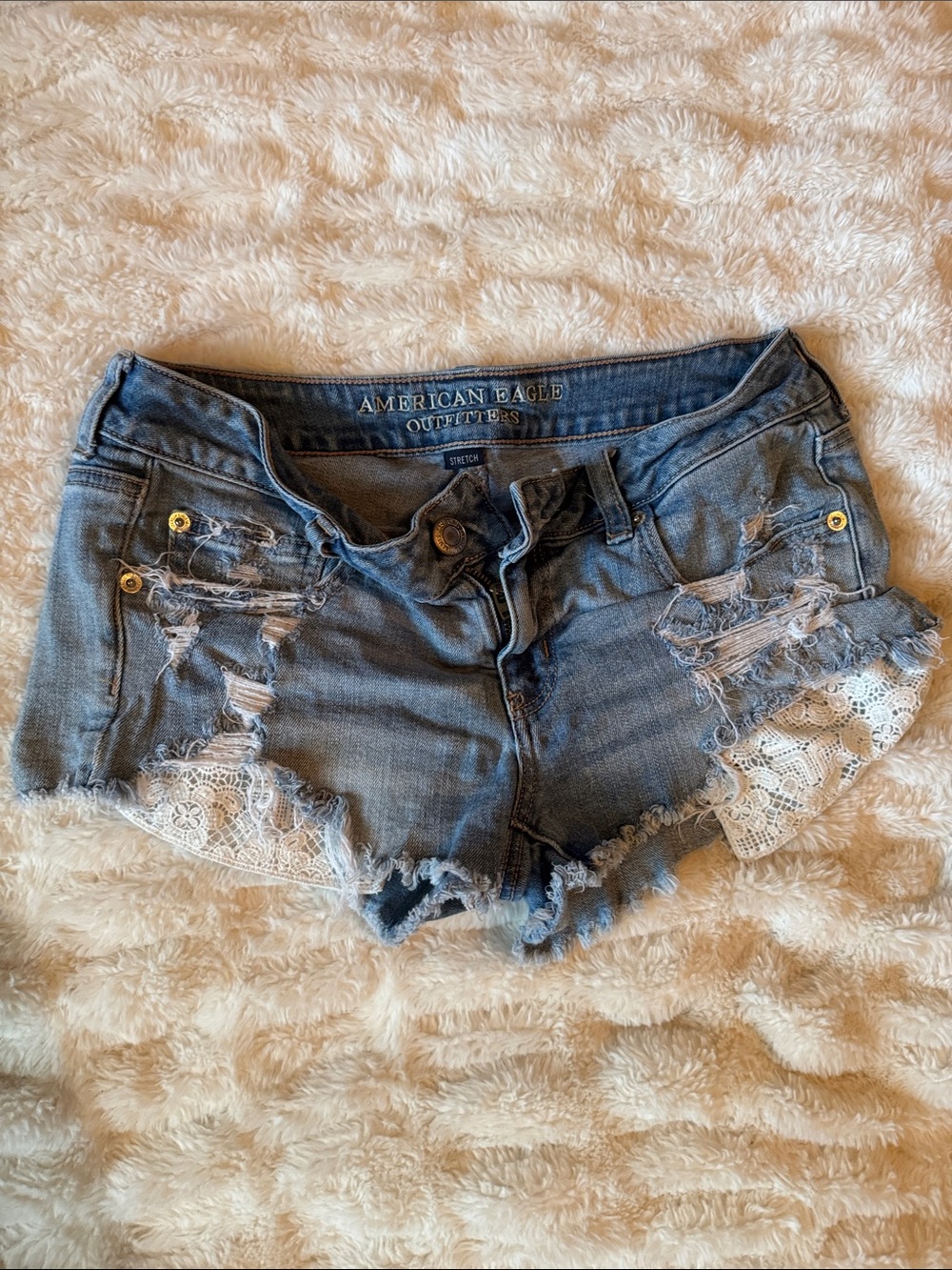 Women’s American Eagle Outfitters Blue Distressed Denim Shorts with White Lace